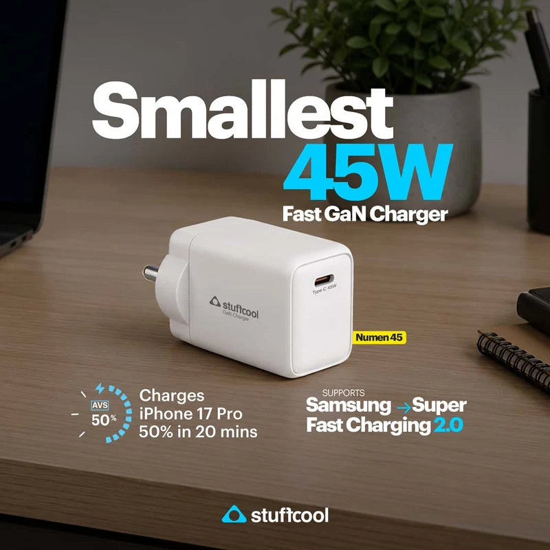 A white Stuffcool 45W fast GaN charger placed on a wooden desk, with promotional text highlighting its compact size and fast charging support for Samsung and Super Fast Charging 2.0.