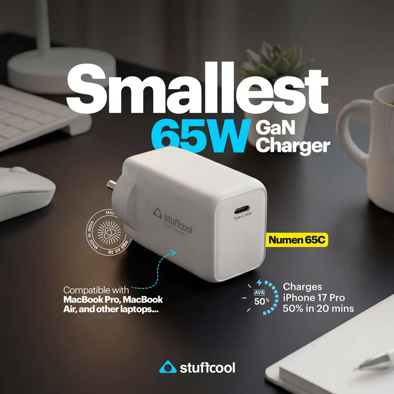 A white Stufcool 65W GaN charger shown on a dark desk with surrounding office props like a keyboard, mug, and notebook. Large text reads 'Smallest 65W GaN Charger' and includes compatibility and charging claims.