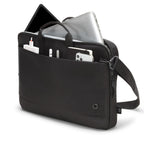 A black laptop and tablet messenger bag with a shoulder strap, shown with a silver laptop, tablet, and various accessories in its compartments against a white background.