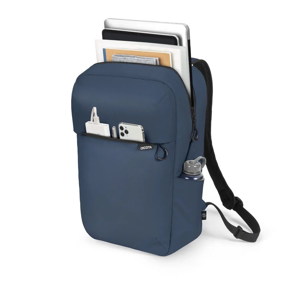 A navy blue backpack shown on a white background, filled with notebooks, a tablet, a smartphone, and a water bottle in its side pocket.