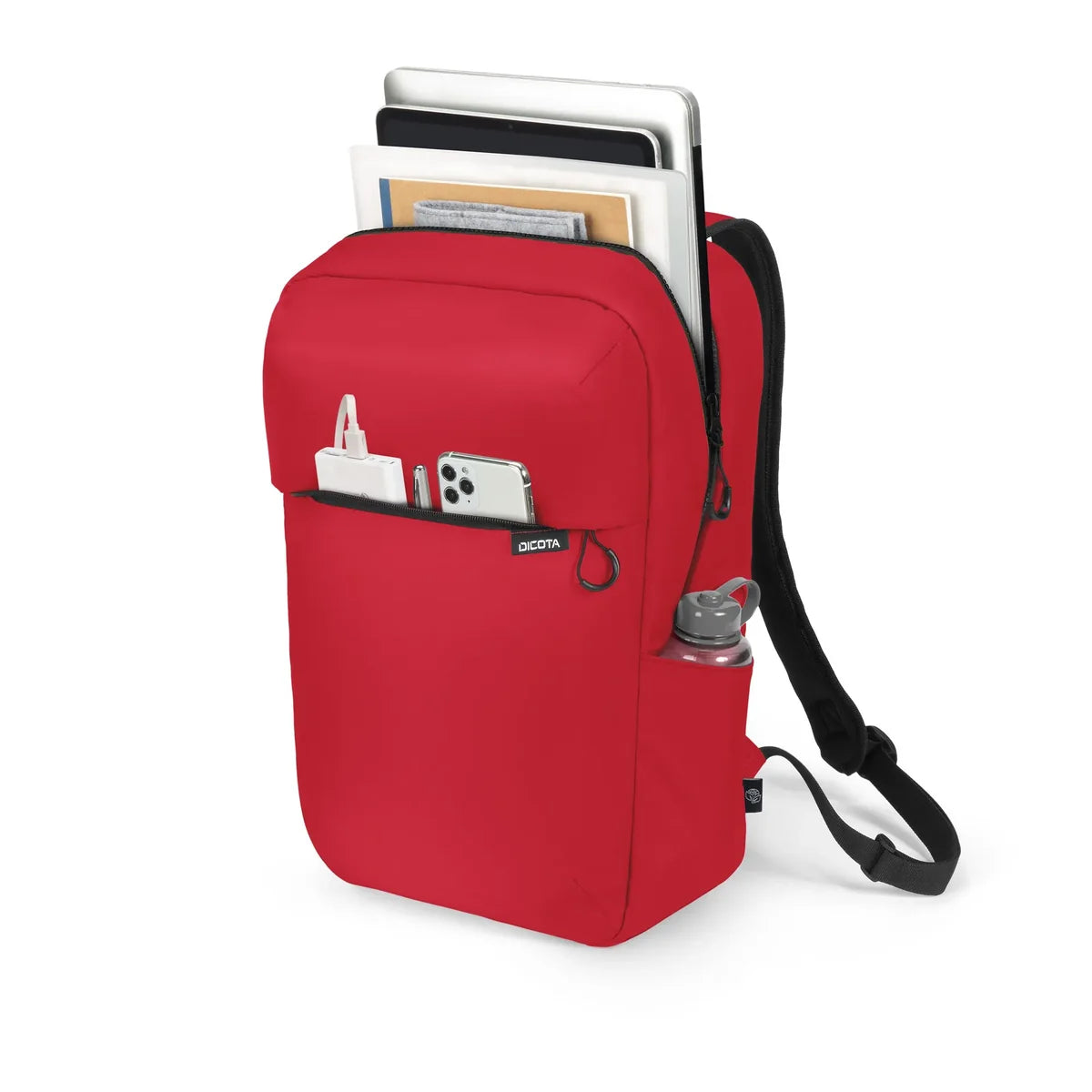 A red backpack-style laptop sleeve with black straps, shown on a white background with a laptop, phone, cardholder, and water bottle inserted into its compartments.