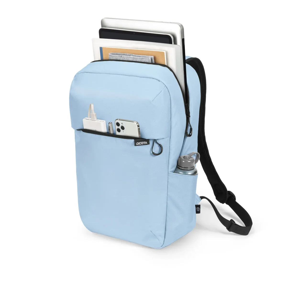 A light blue backpack shown on a white background, filled with books and laptops, with a phone, spray bottle, and water bottle in its front pockets. The brand name 'Society6' is visible on a small black tag on the front pocket.