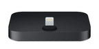 A black rectangular dock with rounded corners and a Lightning connector in the center, shown on a plain white background.