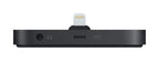 A black rectangular electronic dongle with a Lightning connector plugged into the top center, shown from the side on a plain white background.