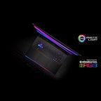 A black SteelSeries gaming laptop shown open at an angle on a dark background, with RGB lighting glowing across the screen edge and keyboard. Brand logos for SteelSeries and RGB lighting appear on the right side of the image.