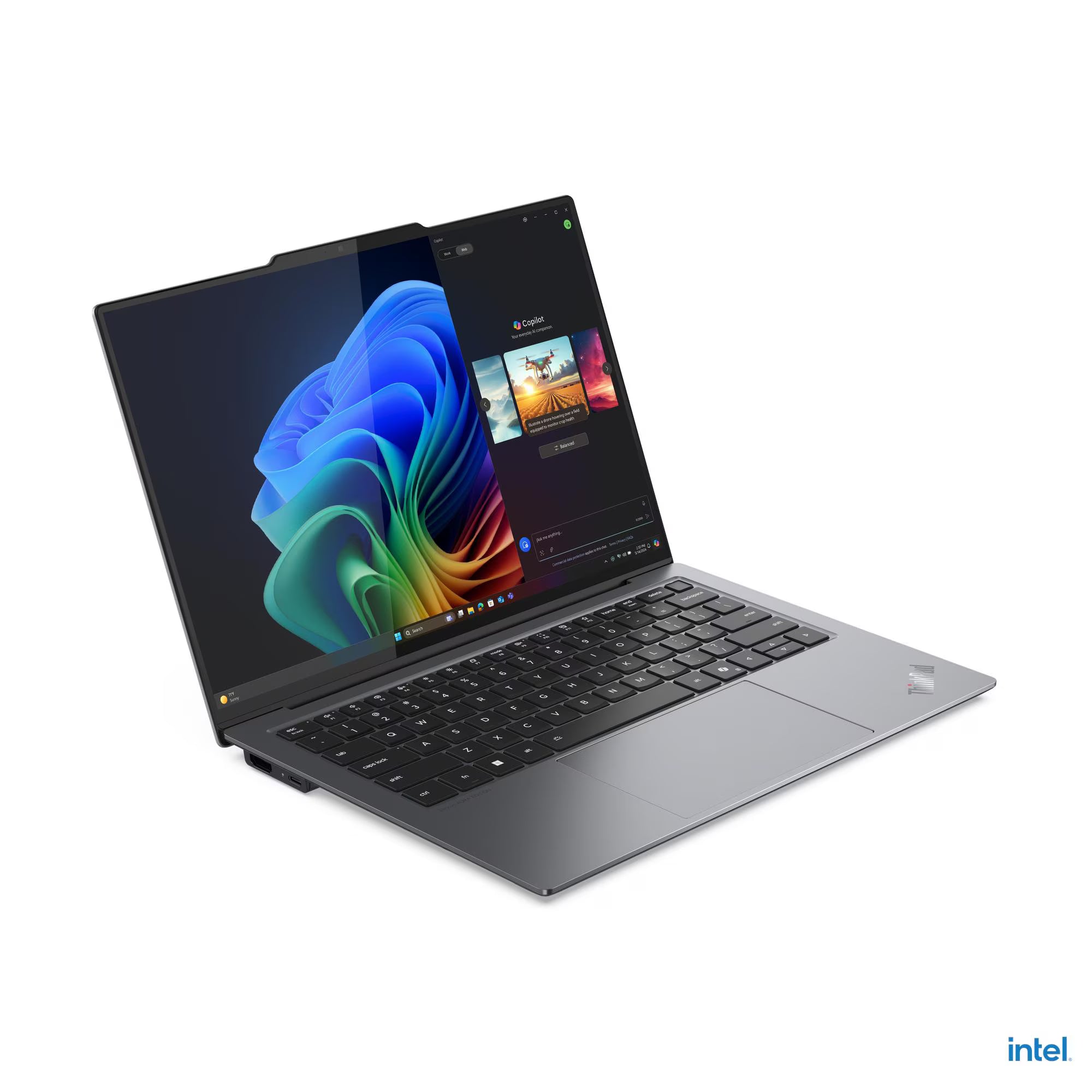 Laptop with colorful display on a white background, featuring Intel branding.