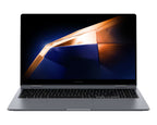 A Samsung laptop in a dark gray finish, shown open and facing forward against a solid white background. The screen displays a dark abstract wallpaper with orange and blue geometric shapes.